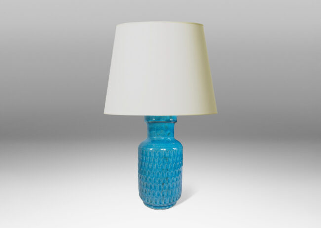 Gallery BAC cylindrical body ornamented with carved ovoid patterns and wide neck, glazed in a shiny turquoise blue