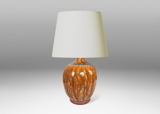 Gallery BAC ovoid form with beaded foot and spouting neck, glazed in a flowing glossy brown with gray-blue