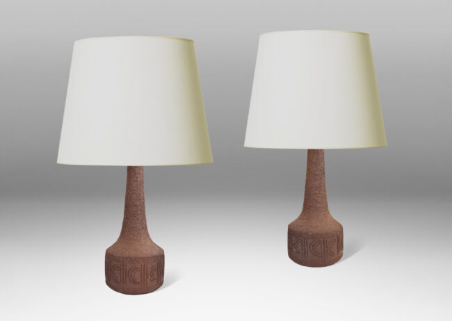Gallery BAC low drum forms with carved geometric patterns and sprouting necks, hand-thrown in unglazed dark brown grog stoneware