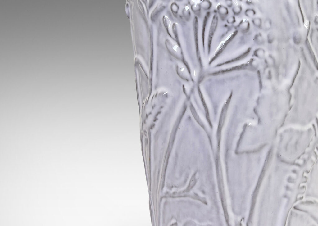 Gallery BAC apered cylindrical form with cast wildflower design in white glaze