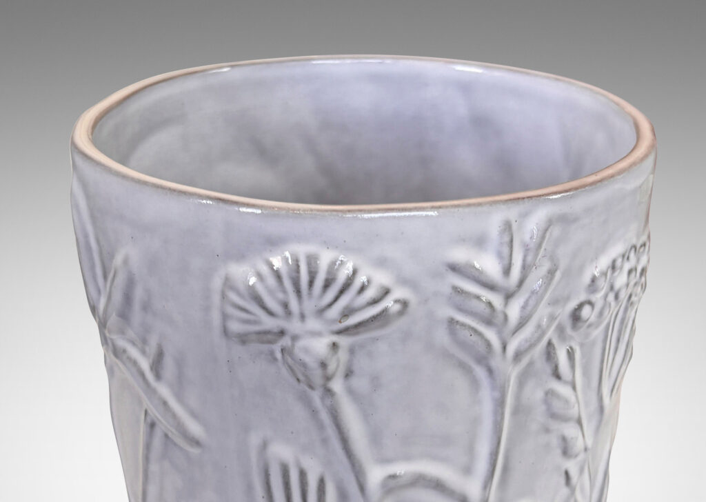 Gallery BAC apered cylindrical form with cast wildflower design in white glaze