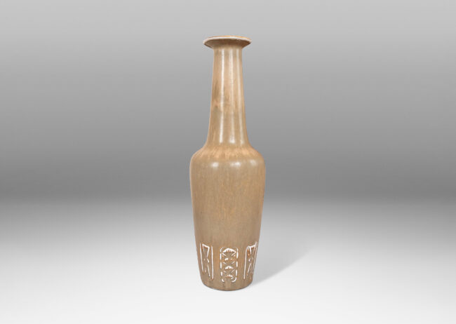 Gallery BAC large rationalized bottle form, with angled sides, impressed geometric motifs, tall neck, and flanged lip