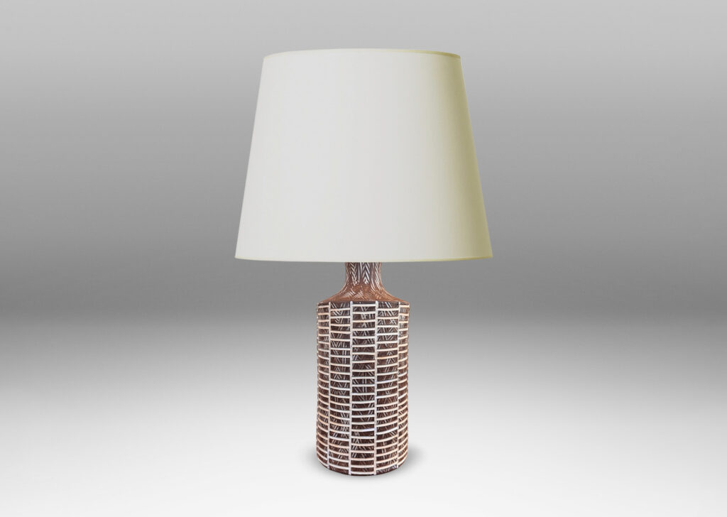 Gallery BAC cylindrical form with cove neck in matte brown ceramic, with carved grid and crosshatch texture highlighted in shiny white glaze