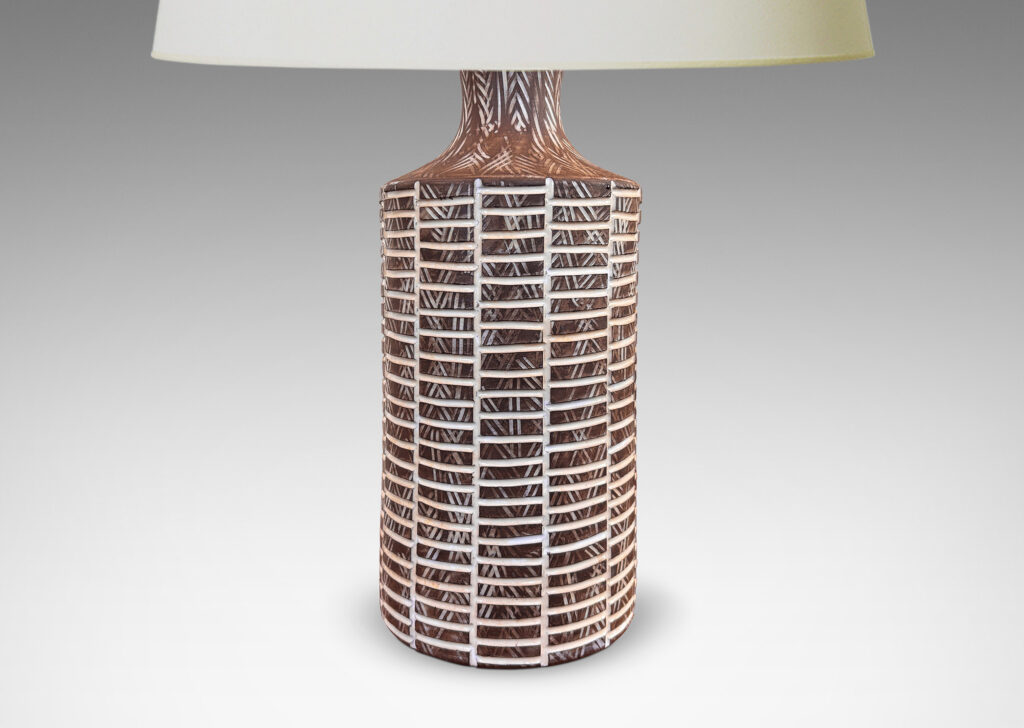 Gallery BAC cylindrical form with cove neck in matte brown ceramic, with carved grid and crosshatch texture highlighted in shiny white glaze