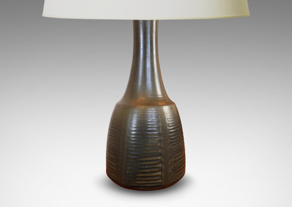 Gallery BAC pawn-like form, with relief linear designs, glazed in an eggshell dark jungle green