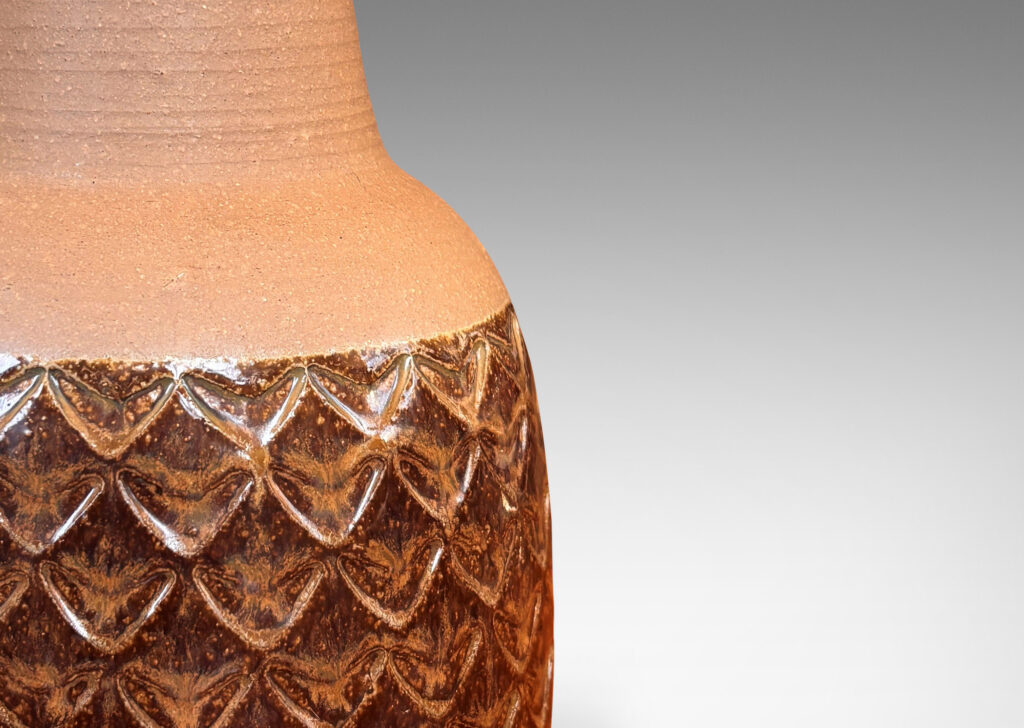 Gallery BAC pawn-like form, with impressed pattern of large chevron motifs, glazed in matte tan and shiny dark brown