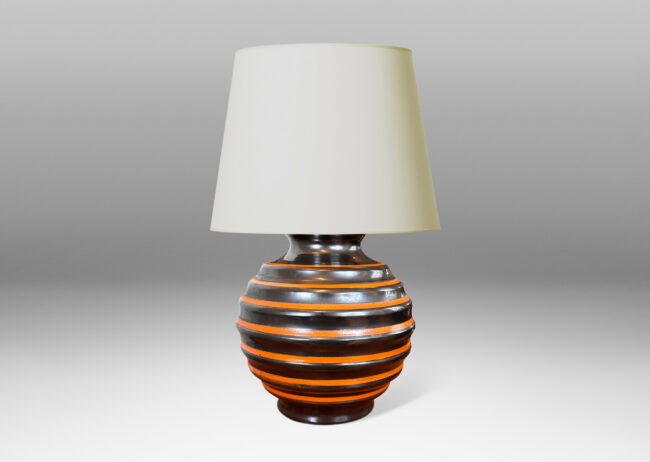 Gallery BAC plump globe form, surrounded in deep horizontal fluting, glazed in brown-black, with thin orange bands
