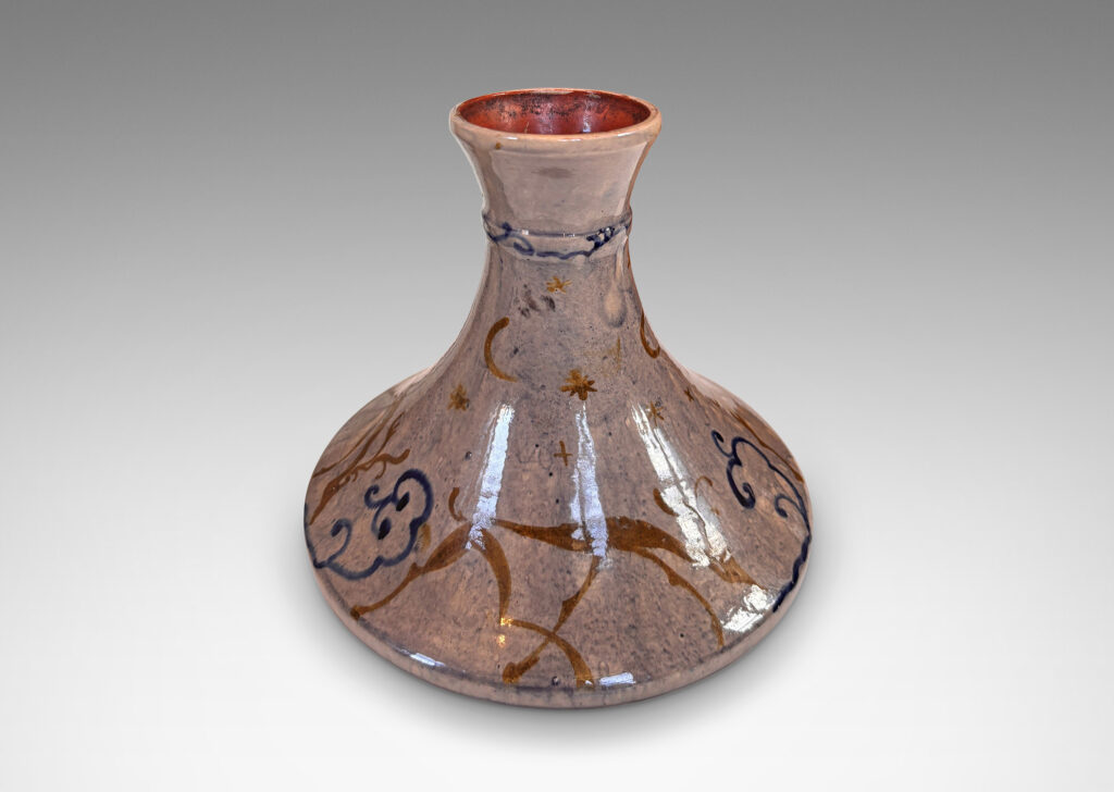 Gallery BAC decanter-like form with tall coved neck, glazed in a thin blue wash over pale rose, overpainted with deer and scrolls in blue and gold
