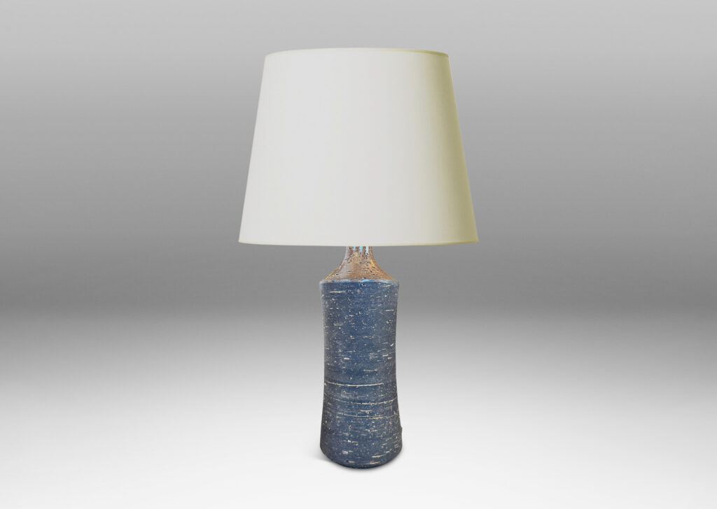 Gallery BAC concave sided cylindrical forms with grog texture and matte brown glaze, with shiny brown caps