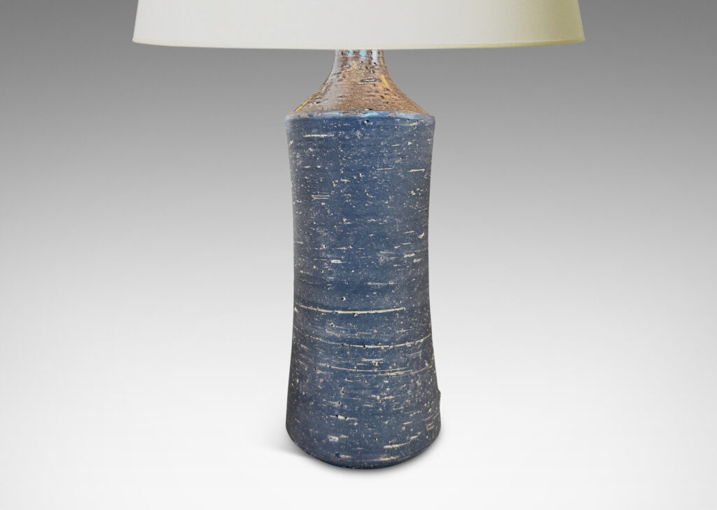 Gallery BAC concave sided cylindrical forms with grog texture and matte brown glaze, with shiny brown caps