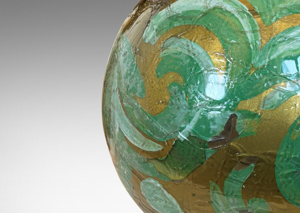Gallery BAC globe form in craquel verre églomisé, back-painted in a scrolling pattern in gold and pale green tones