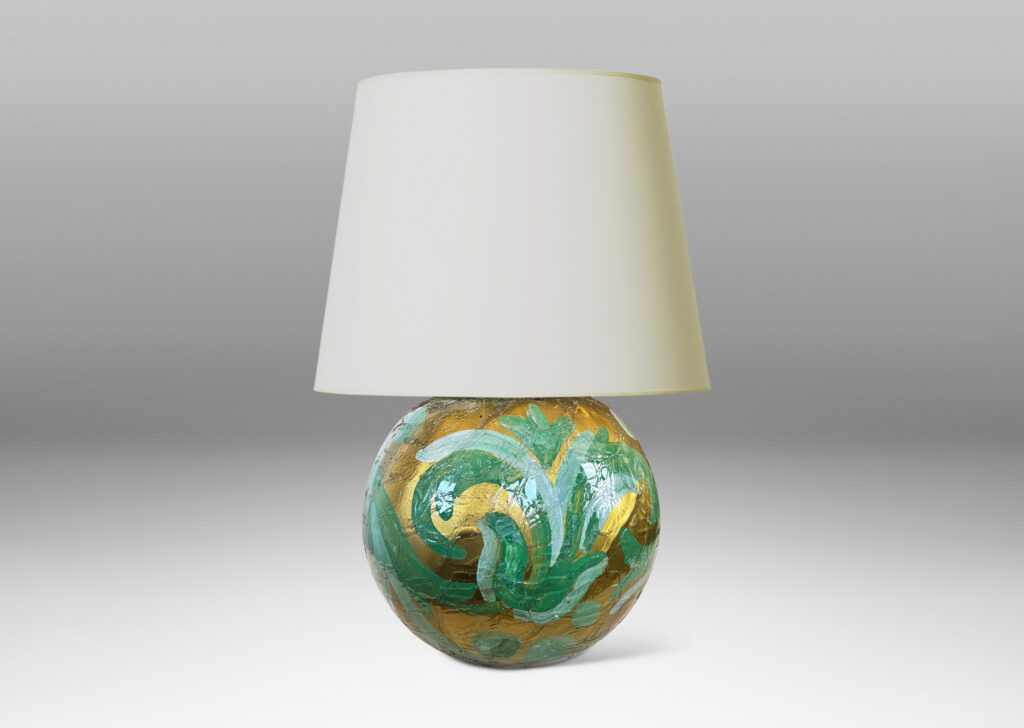 Gallery BAC globe form in craquel verre églomisé, back-painted in a scrolling pattern in gold and pale green tones