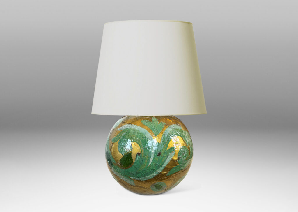 Gallery BAC globe form in craquel verre églomisé, back-painted in a scrolling pattern in gold and pale green tones