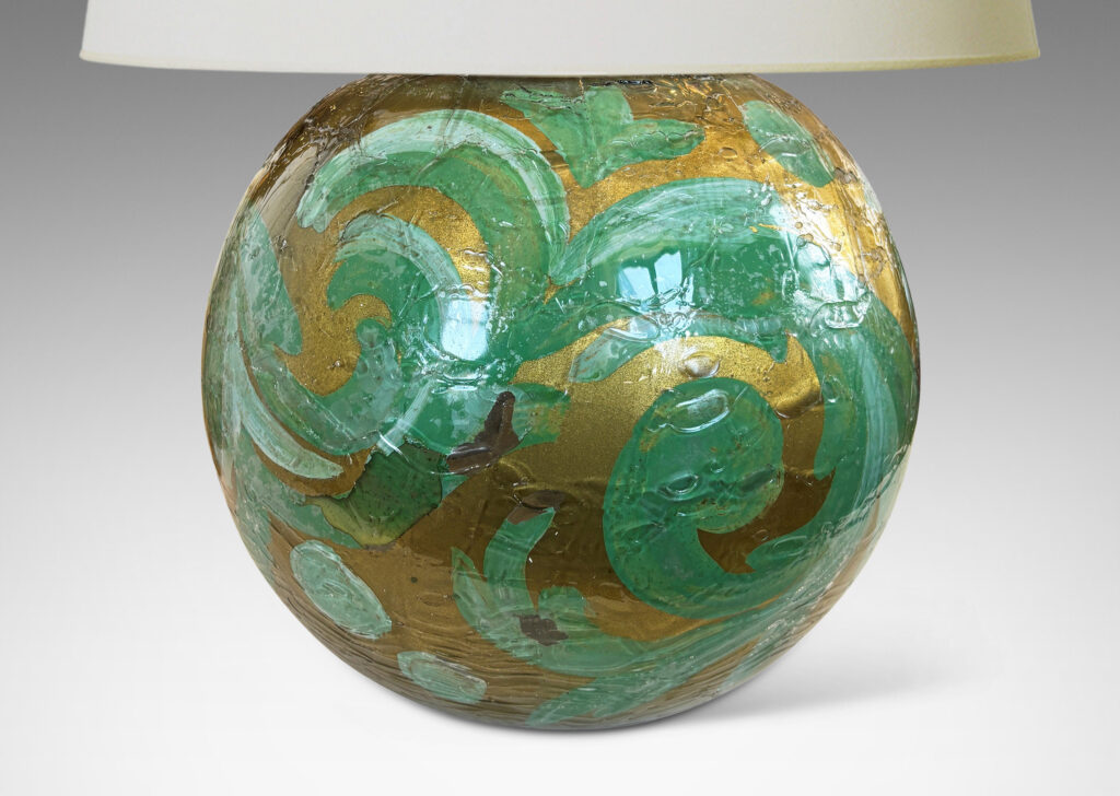 Gallery BAC globe form in craquel verre églomisé, back-painted in a scrolling pattern in gold and pale green tones