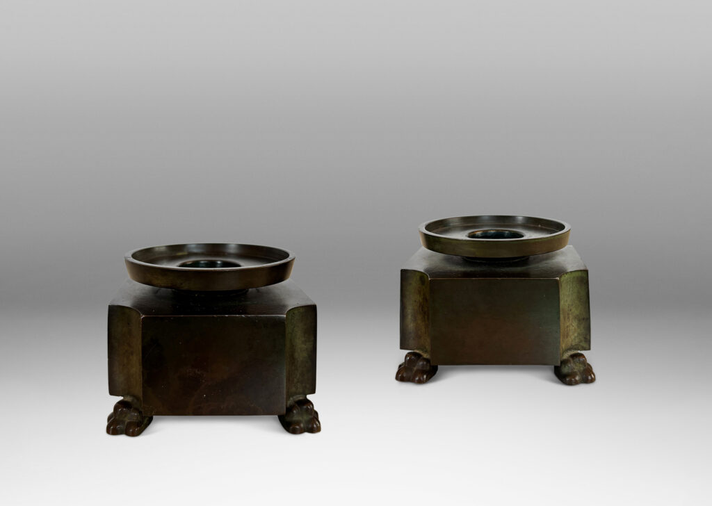 Gallery BAC notched square bases, with floating bobèches and lion paw feet