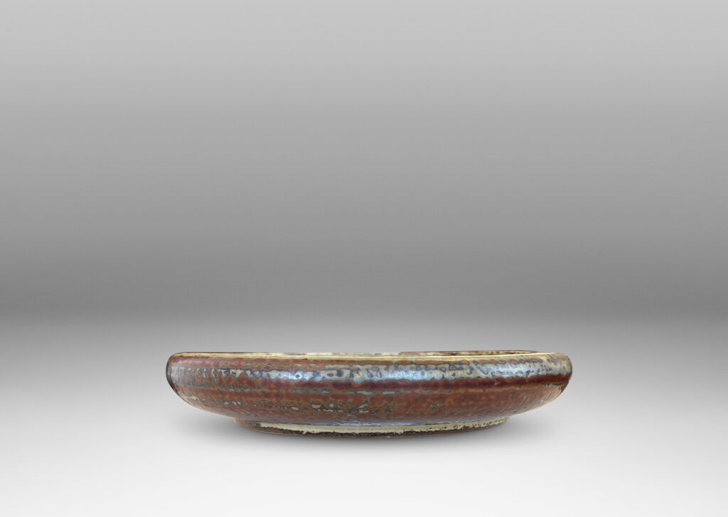 Gallery BAC shallow organically modeled curving sides, concentric ridging, and a handsome brown and pale gray