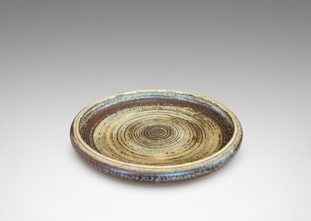 Gallery BAC shallow organically modeled curving sides, concentric ridging, and a handsome brown and pale gray