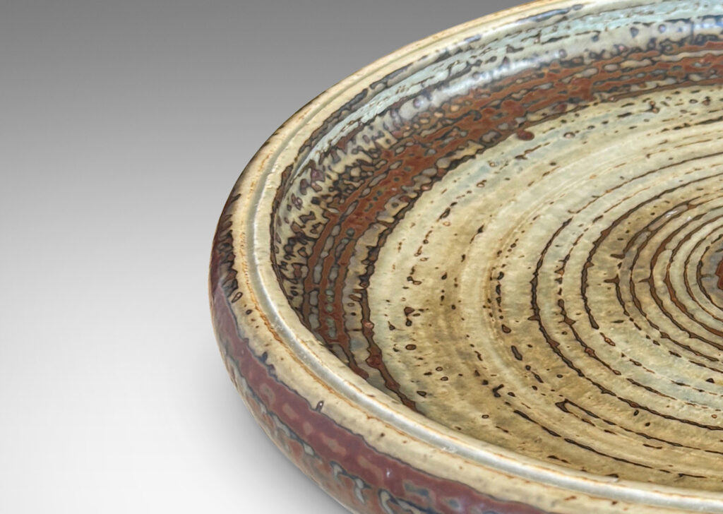 Gallery BAC shallow organically modeled curving sides, concentric ridging, and a handsome brown and pale gray