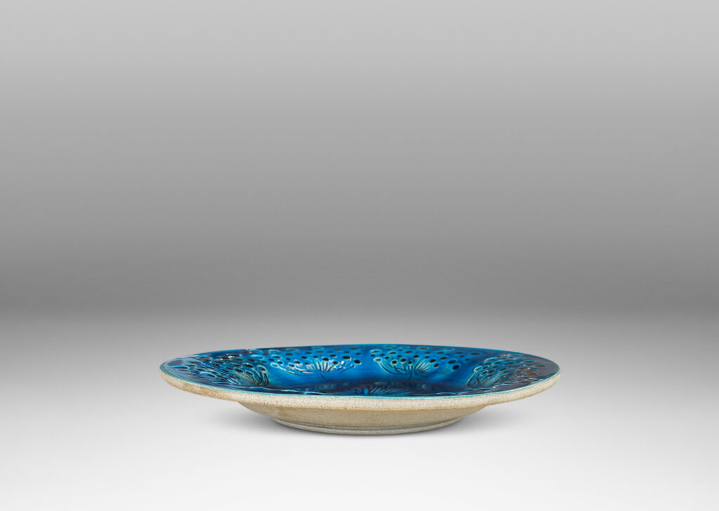 Gallery BAC wide curving lip and carved design of dill or yarrow flower umbels, glazed in a saturated shiny azure, with matte pale gray reverse