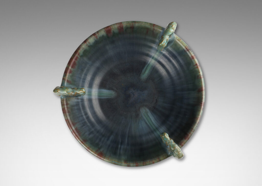 Gallery BAC stepped angled side and three high relief foliate ornaments, glazed in a flowing green