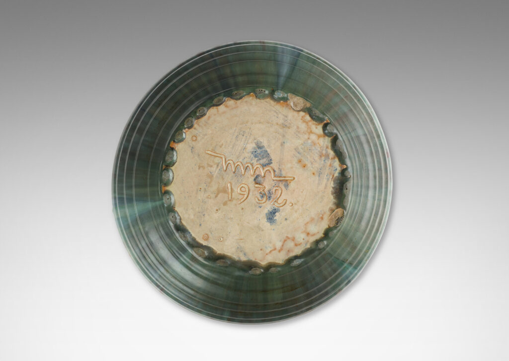 Gallery BAC stepped angled side and three high relief foliate ornaments, glazed in a flowing green