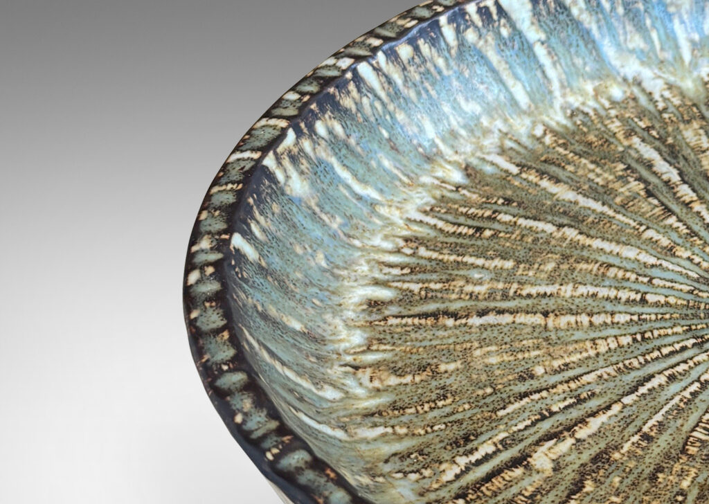 Gallery BAC clean form with angled sides, with carved surface texture and flowing brown glaze