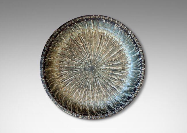 Gallery BAC clean form with angled sides, with carved surface texture and flowing brown glaze