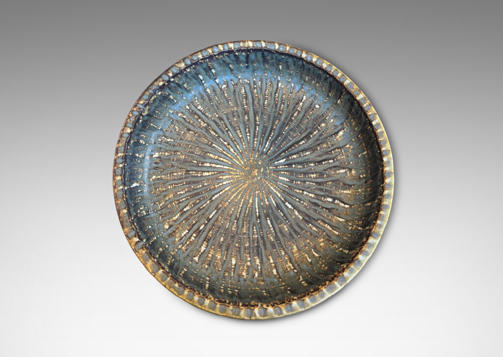 Gallery BAC clean form with angled sides, with carved surface texture and flowing brown glaze