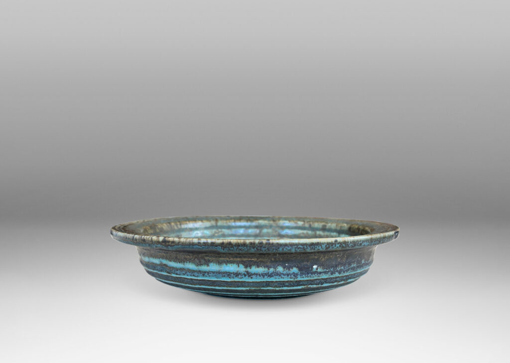 Gallery BAC flat flanged lip and relief concentric circles inside, glazed in gray-brown and pale blue