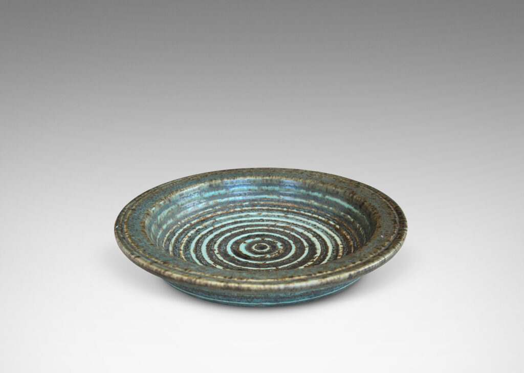 Gallery BAC flat flanged lip and relief concentric circles inside, glazed in gray-brown and pale blue