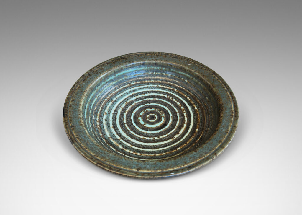 Gallery BAC flat flanged lip and relief concentric circles inside, glazed in gray-brown and pale blue