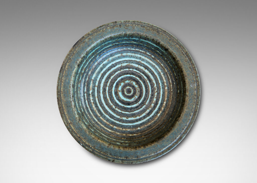 Gallery BAC flat flanged lip and relief concentric circles inside, glazed in gray-brown and pale blue