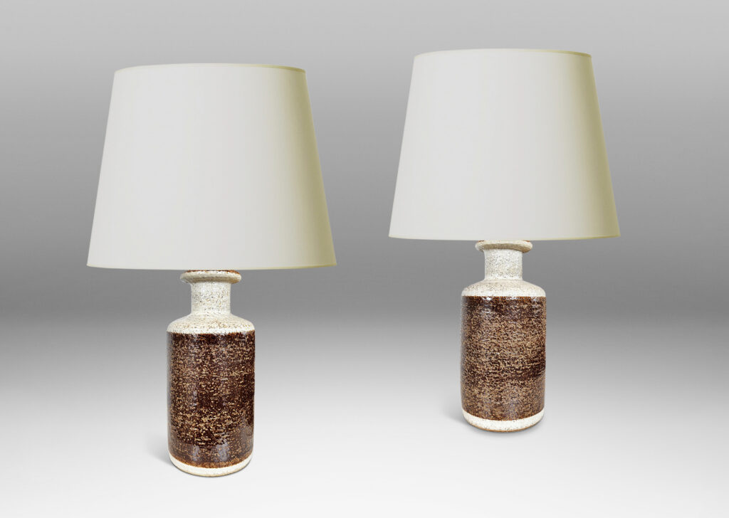 Gallery BAC textured canister forms, with cylindrical bodies, wide necks and flange tops, glazed in brown and white