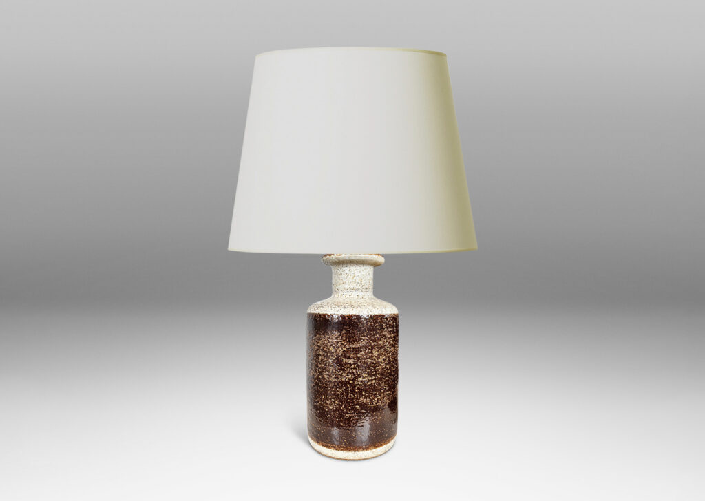 Gallery BAC textured canister forms, with cylindrical bodies, wide necks and flange tops, glazed in brown and white