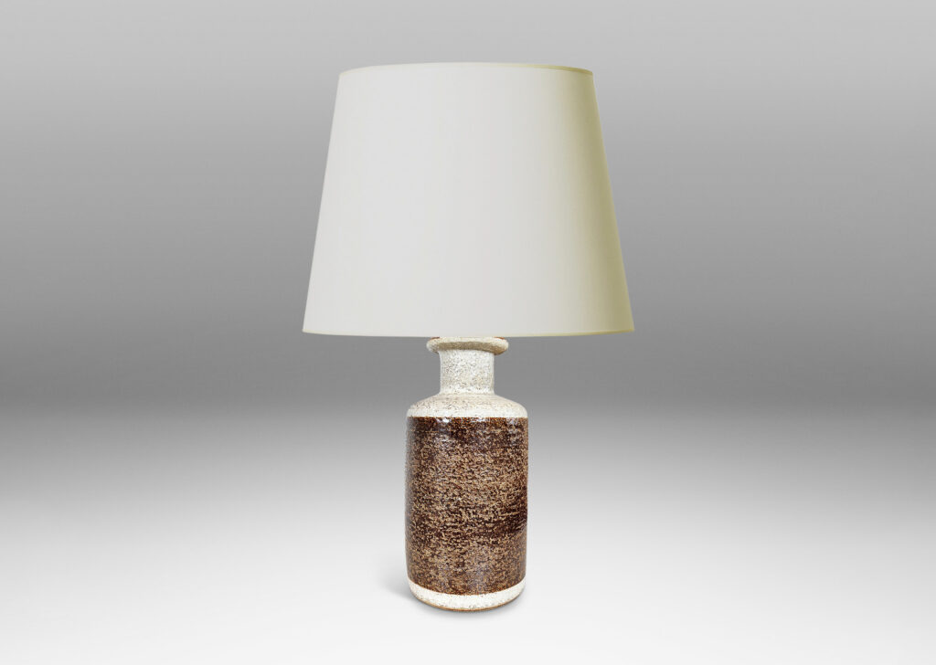 Gallery BAC textured canister forms, with cylindrical bodies, wide necks and flange tops, glazed in brown and white