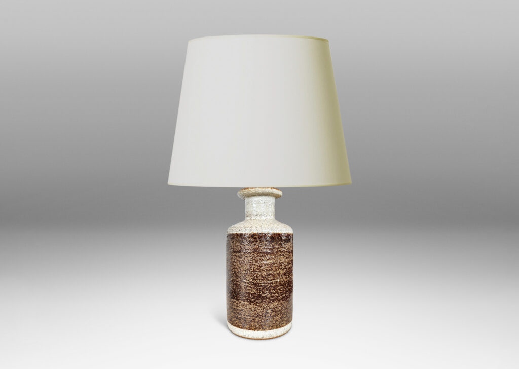 Gallery BAC textured canister forms, with cylindrical bodies, wide necks and flange tops, glazed in brown and white