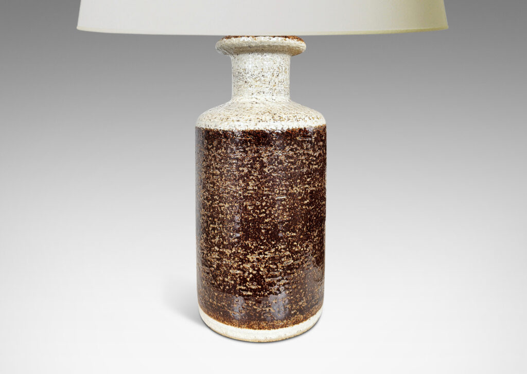 Gallery BAC textured canister forms, with cylindrical bodies, wide necks and flange tops, glazed in brown and white