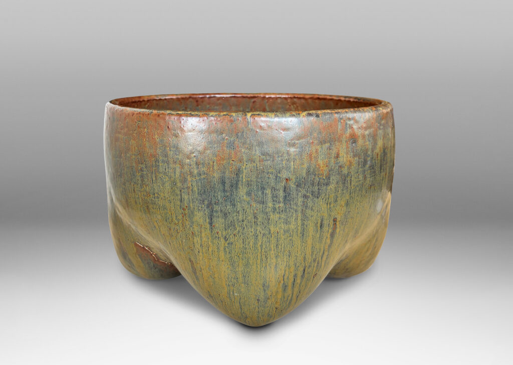Gallery BAC sculptural muscular form with quadruped base, glazed in flowing drab green, with hints of warm brown and black
