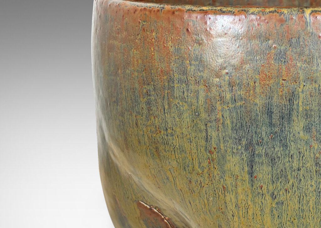 Gallery BAC sculptural muscular form with quadruped base, glazed in flowing drab green, with hints of warm brown and black