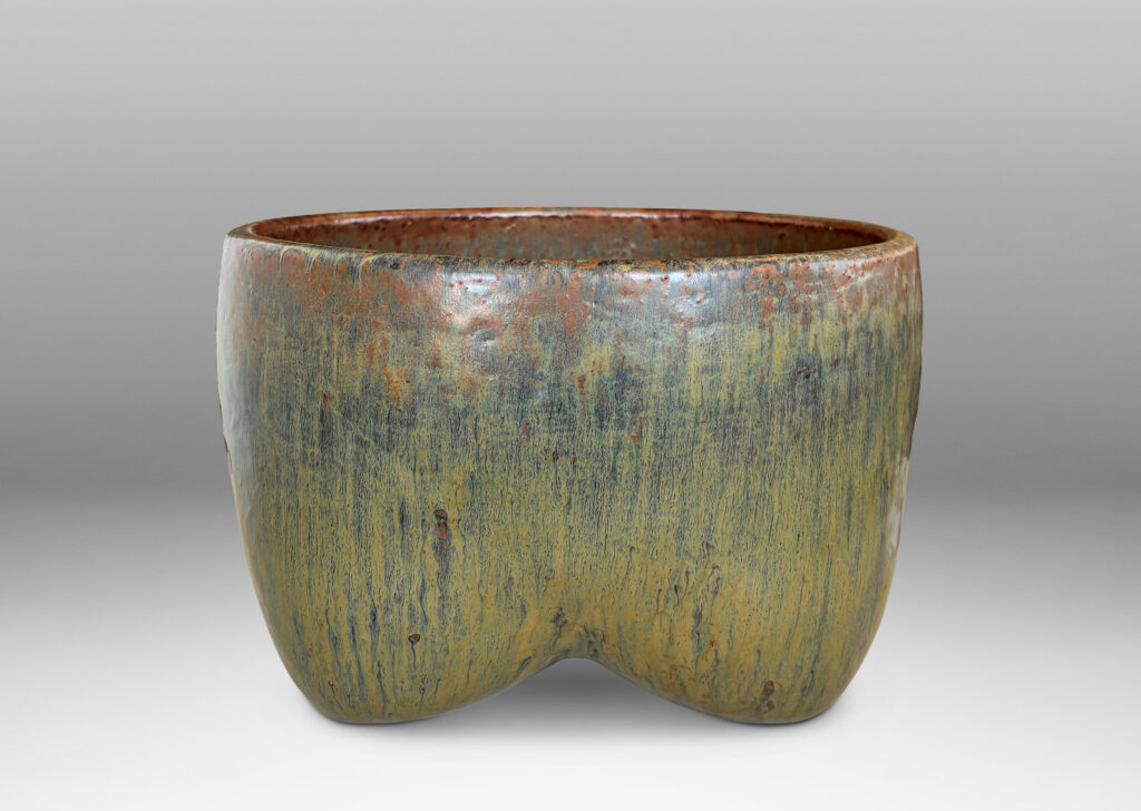 Gallery BAC sculptural muscular form with quadruped base, glazed in flowing drab green, with hints of warm brown and black