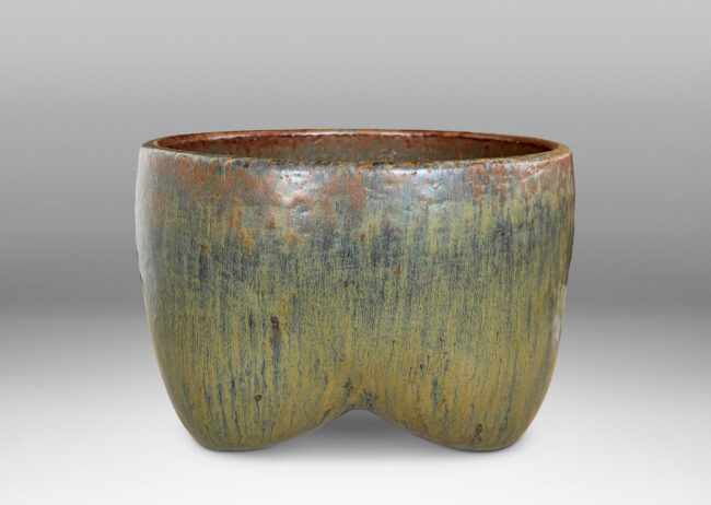 Gallery BAC sculptural muscular form with quadruped base, glazed in flowing drab green, with hints of warm brown and black