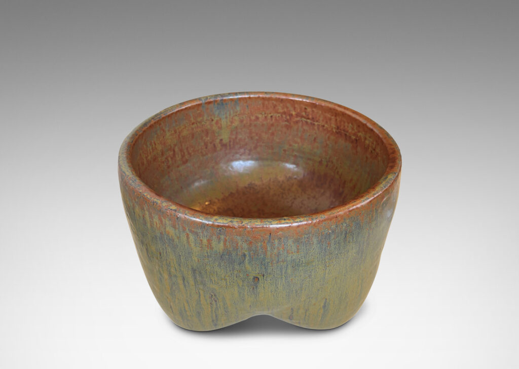 Gallery BAC sculptural muscular form with quadruped base, glazed in flowing drab green, with hints of warm brown and black