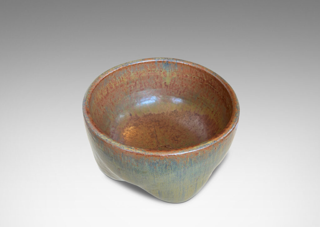 Gallery BAC sculptural muscular form with quadruped base, glazed in flowing drab green, with hints of warm brown and black