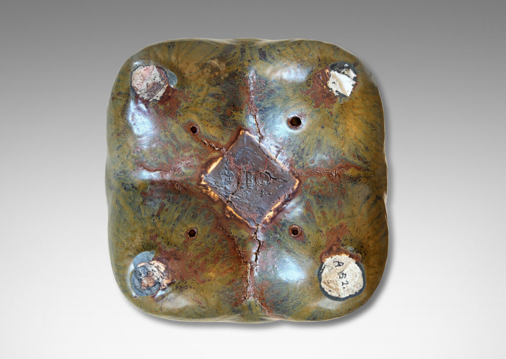 Gallery BAC sculptural muscular form with quadruped base, glazed in flowing drab green, with hints of warm brown and black