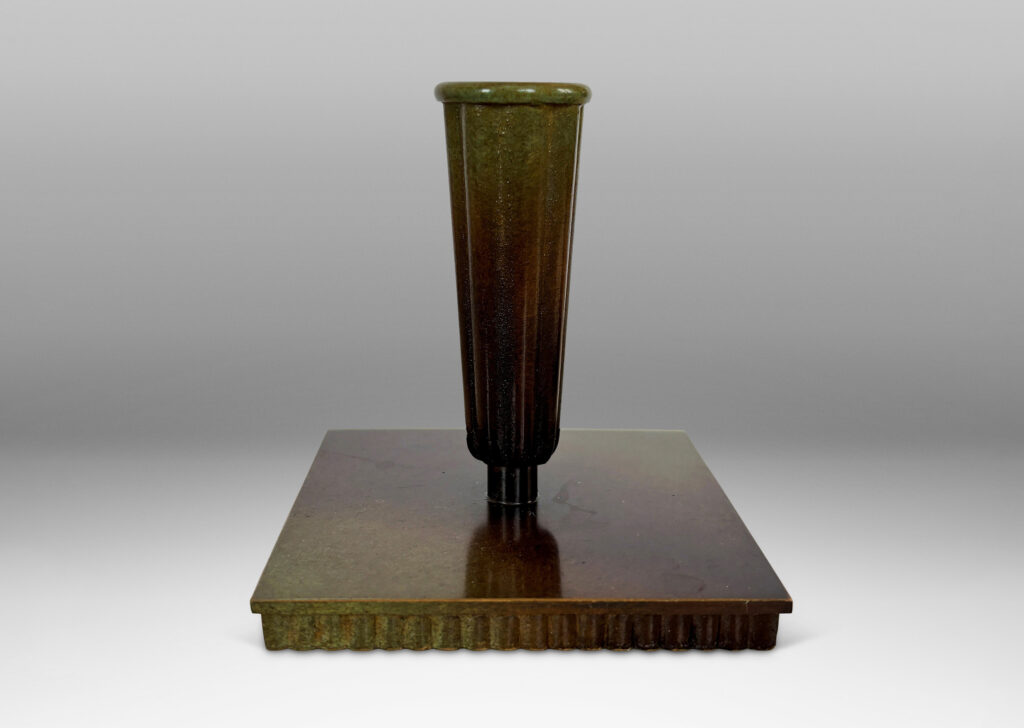 Gallery BAC fluted trumpet sockets and square base over a scalloped reveals, finished with a handsome enameled verdigris-antique patination