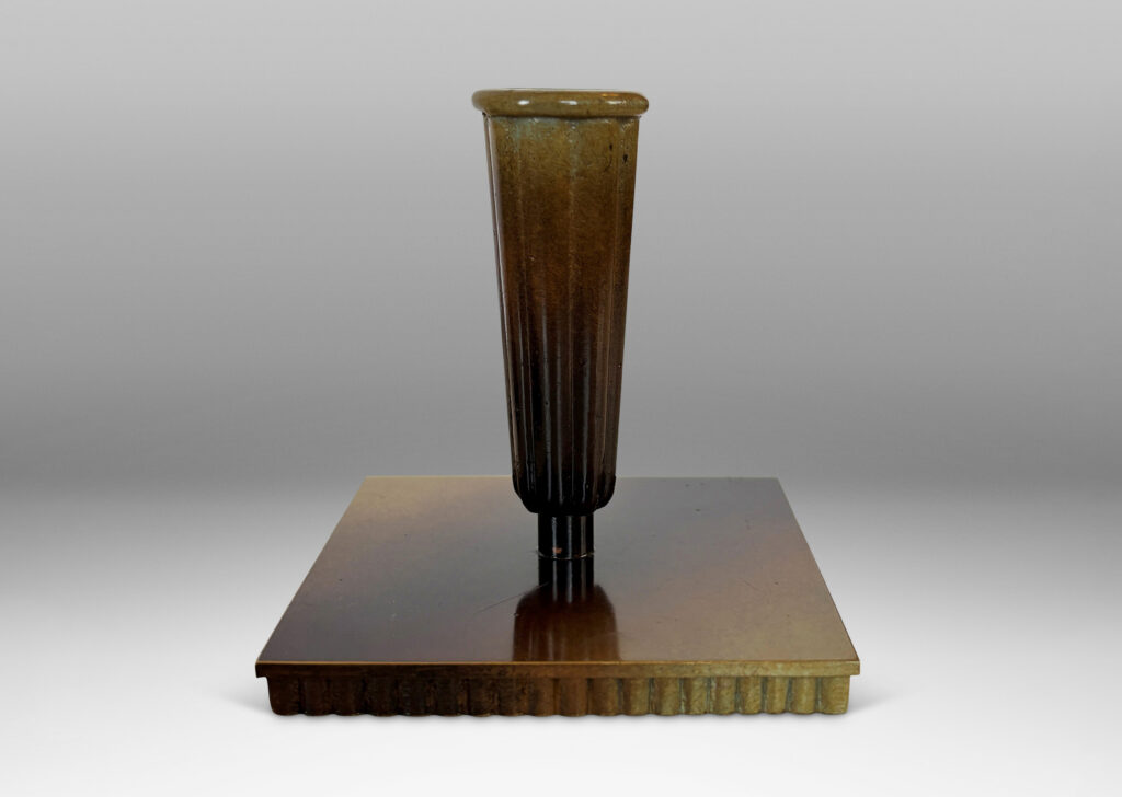 Gallery BAC fluted trumpet sockets and square base over a scalloped reveals, finished with a handsome enameled verdigris-antique patination