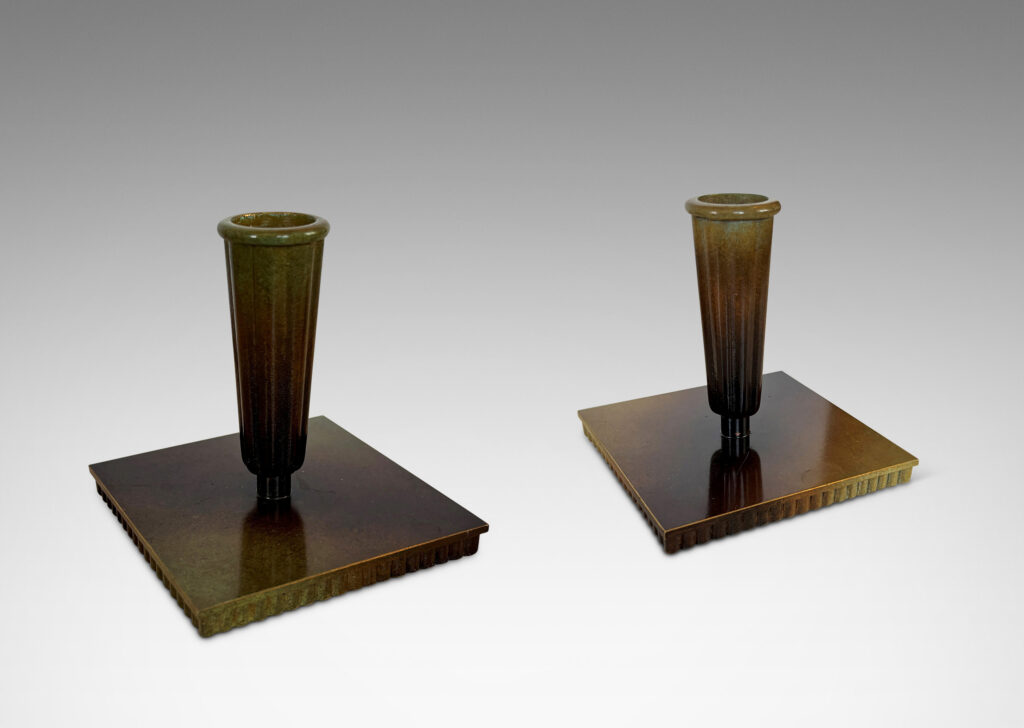Gallery BAC fluted trumpet sockets and square base over a scalloped reveals, finished with a handsome enameled verdigris-antique patination