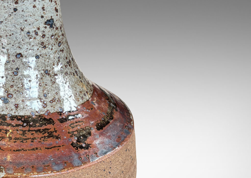 Gallery BAC drum form with tall sprouting neck, partially glazed in mottled pale gray and black-red luster