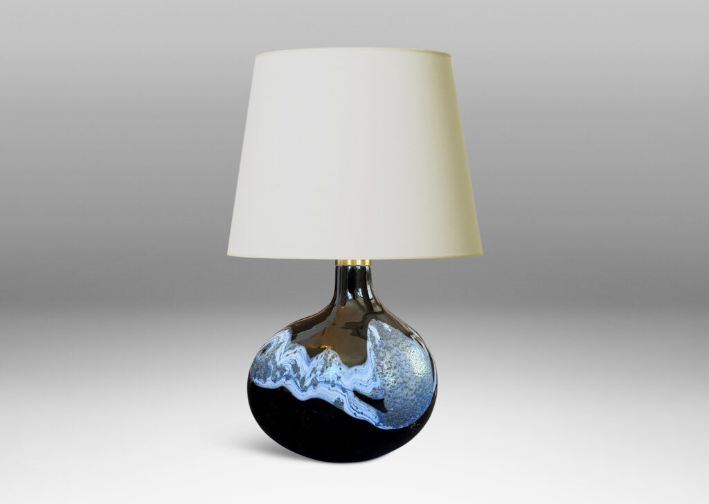 oblong forms with offset sprouting necks, in black with wavy nacreous collar