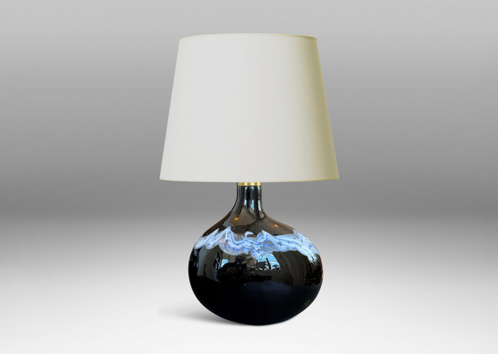 oblong forms with offset sprouting necks, in black with wavy nacreous collar